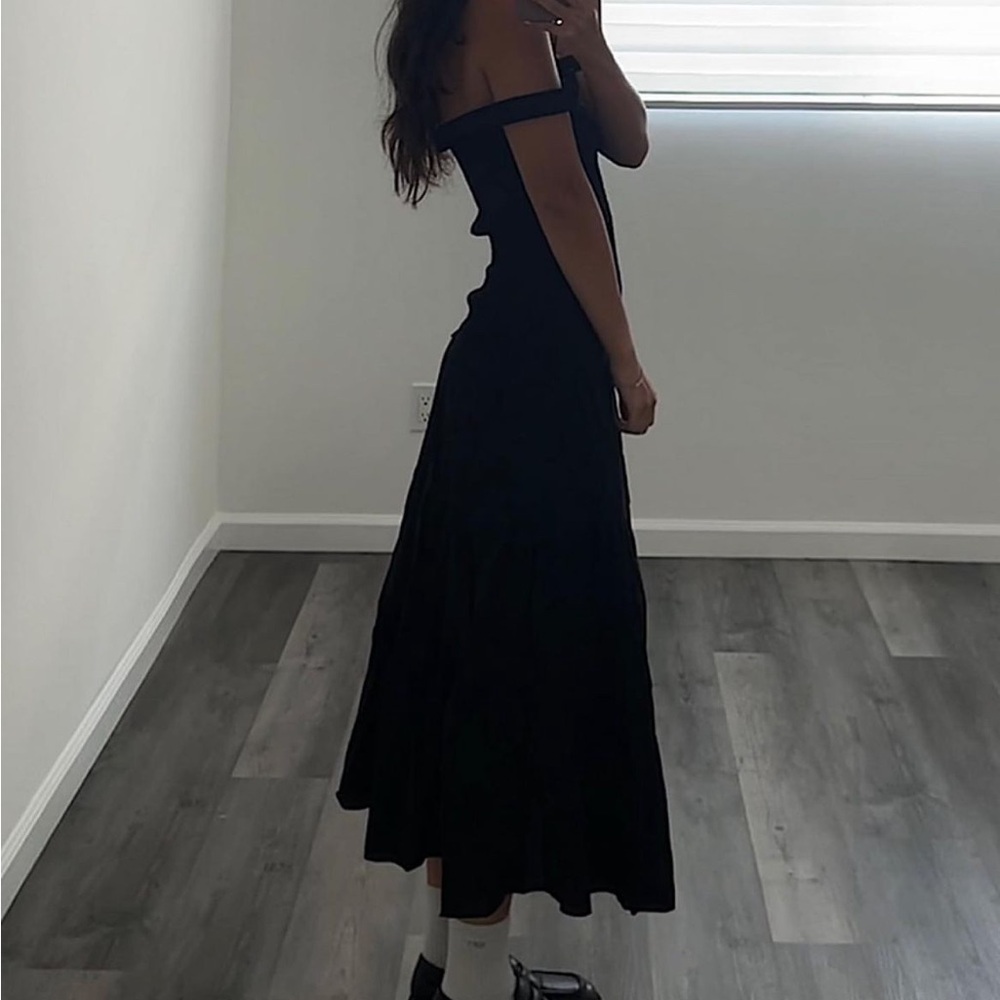Black smocked drop hem dress